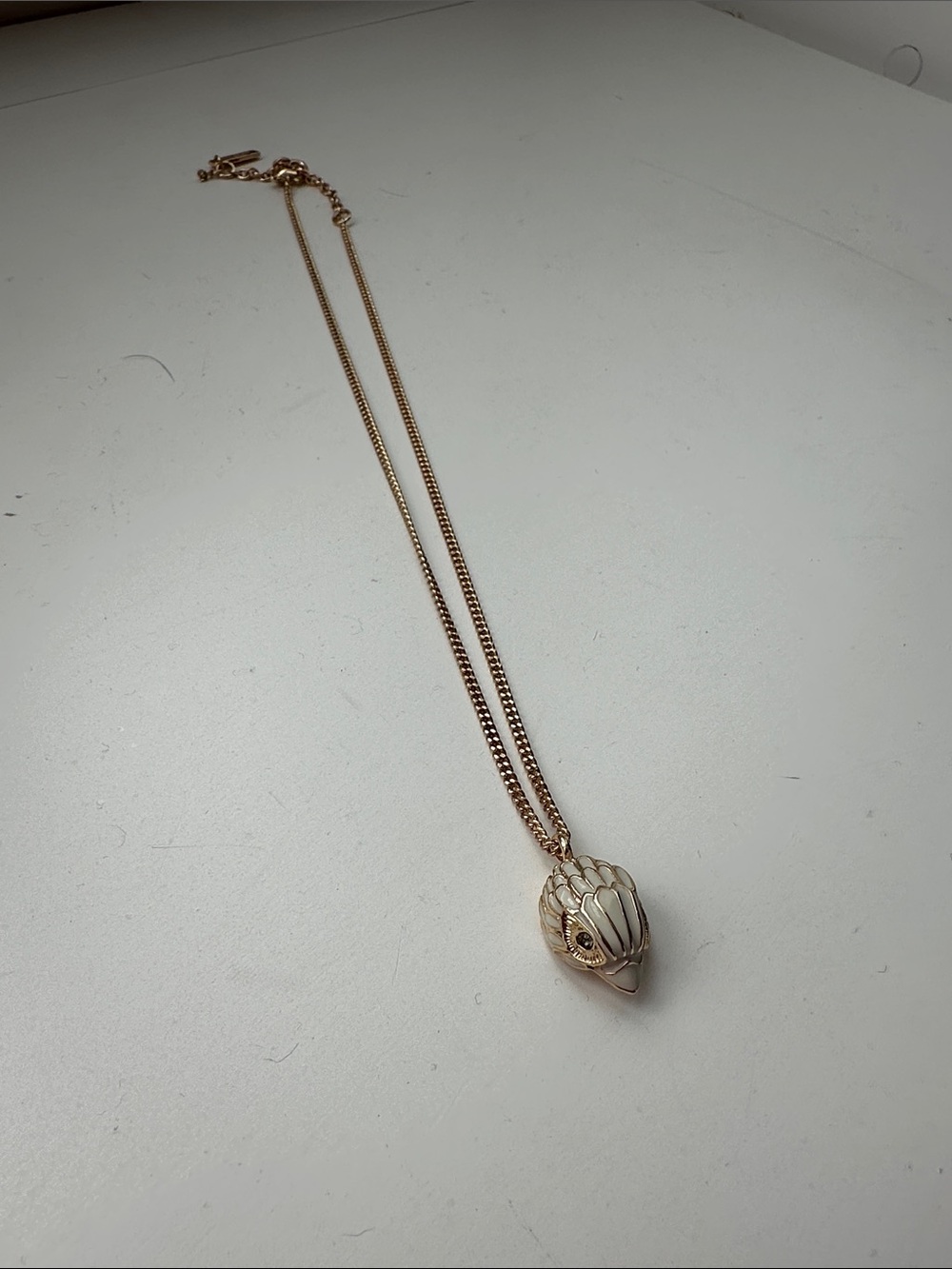 Kurt Geiger Rose Gold Pendant Necklace with Cream Enamel eagle head charm